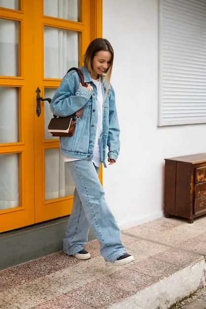 A woman in a casual chic outfit from Shein, featuring a white tee, ripped jeans, a denim jacket, and white sneakers, accessorized with a colorful scarf and a crossbody bag.