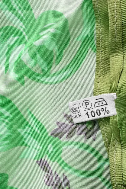A close-up shot of a garment label showing the GOTS (Global Organic Textile Standard) certification logo, highlighting the details of what this certification means for organic and ethical textile production.