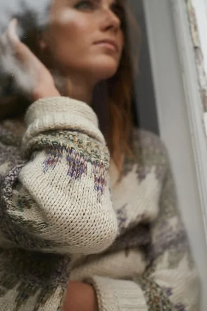 A close-up shot of a Shein oversized knit sweater paired with high-waisted leggings on a white background. The sweater is a neutral color (beige or light gray) and the leggings are black, showcasing the texture and comfort of the materials.