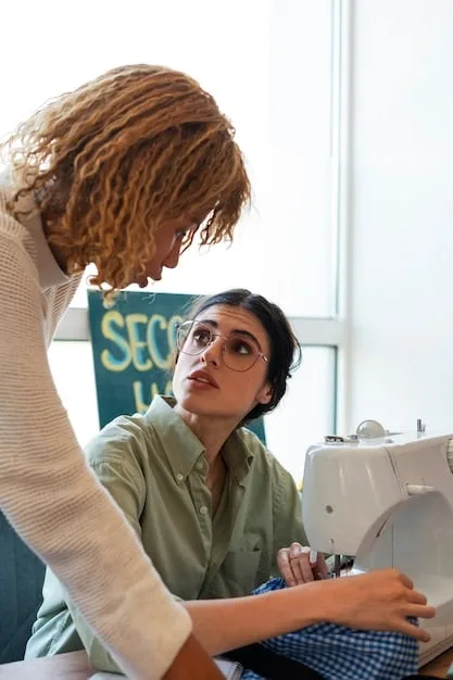 A person working at a sewing machine, focused on stitching together different fabric pieces to create a new garment. The workspace is well-lit and organized, with various sewing tools and fabric swatches within reach. The image conveys precision and attention to detail in the sewing process.