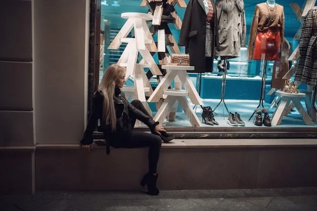 A view inside a busy outlet store, showing racks of clothing, shoes, and accessories, with signs indicating discounted prices, and shoppers browsing the merchandise.