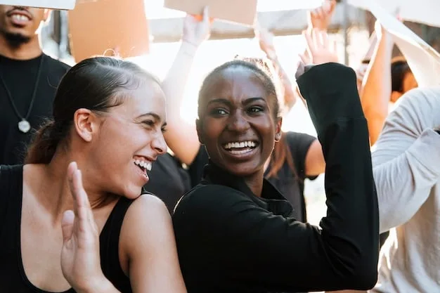 A diverse group of people celebrating success and supporting each other, with a sense of community and shared achievement.