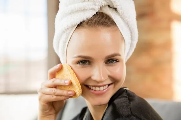 A woman exfoliating her skin in the shower using a scrub and a loofah. The focus is on the action of gently buffing the skin in circular motions.