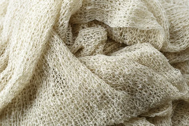 Close-up shot of various eco-friendly fabrics, including organic cotton, hemp, and recycled polyester. The textures and colors are vibrant, highlighting the aesthetic appeal of these sustainable materials.