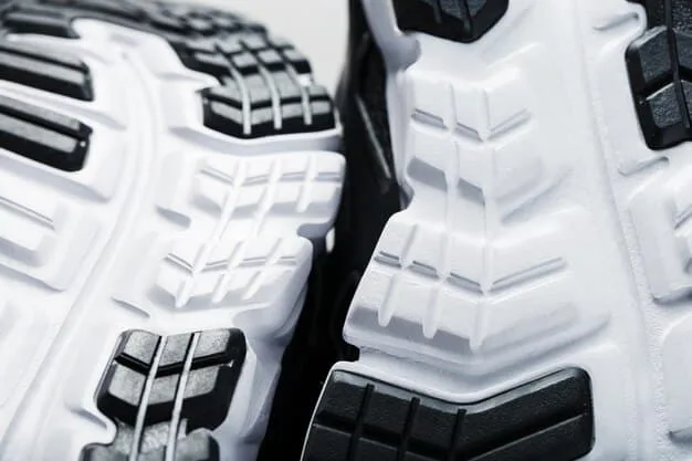 Close-up of an athletic shoe with advanced cushioning technology. The cushioning system features visible air pockets and adaptive foam layers. The shoe is designed to highlight its ergonomic construction and high-performance materials, suitable for running or training.