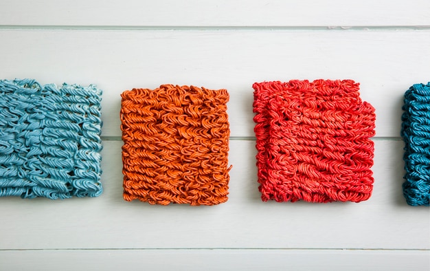 A close-up shot of various fabric swatches displaying a range of textures and qualities, highlighting how specific materials can elevate the perceived value of an inexpensive garment despite its low price.