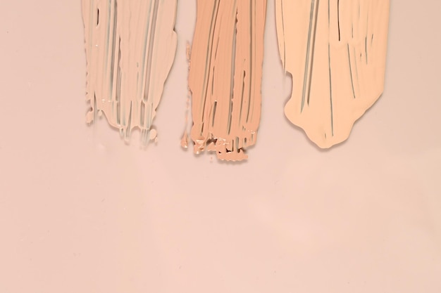A detailed shot of different foundation textures and finishes on a skin tone, illustrating the difference between matte, dewy, and hydrating formulas. The image shows how some formulations can enhance wrinkles while others provide a smoothing effect.