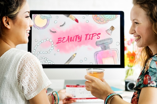 A screenshot of a virtual try-on feature on a makeup retailer's website, showing a person's face with different foundation shades applied virtually. The interface includes options to adjust lighting and share the look.