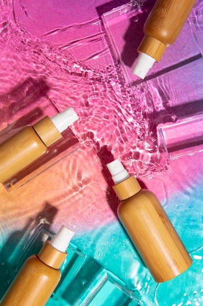 A variety of makeup primers displayed, including pore-minimizing, hydrating, and illuminating options. The background is blurred to focus on the primer bottles and tubes.