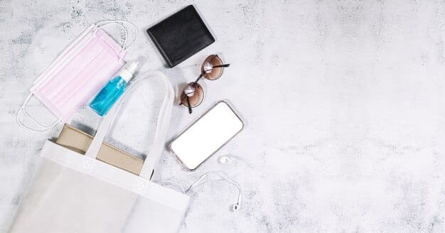 A flat lay of a large tote bag filled with daytime essentials (wallet, phone, water bottle, notebook) next to a small, elegant clutch containing only the essentials (lipstick, phone, credit card).