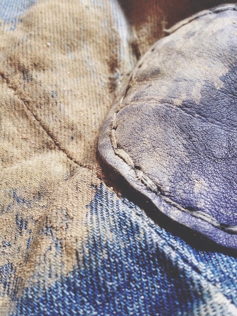A close-up of a denim jacket, showcasing its texture, stitching, and various washes. The image highlights the versatility of the jacket.