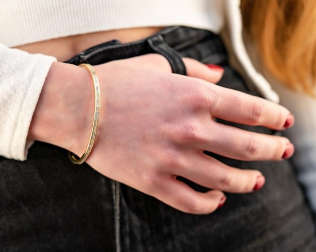 A close-up shot of a woman's hands showcasing delicate gold rings and a simple bracelet, emphasizing the elegance of minimalist jewelry in casual accessorizing.