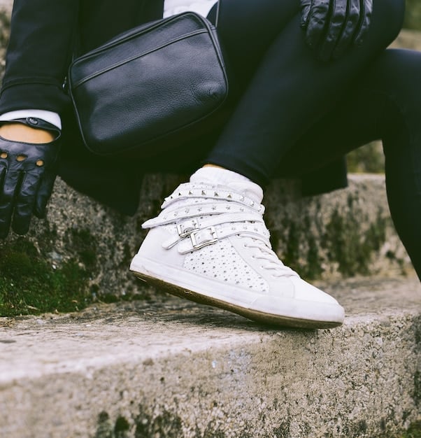 A selection of stylish sneakers in various colors (white, black, neutral), showcasing the versatility of sneakers as a fashionable accessory option for casual outfits.