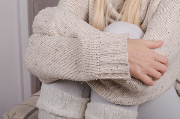 A close-up shot of a woman's outfit detailing the luxurious texture of a cashmere sweater paired with the sleek fabric of wide-leg silk trousers. Emphasis is on showcasing comfort and high-quality materials.