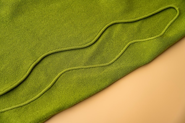 Close-up of sustainable athflow fabrics: organic cotton joggers, bamboo fiber top, and recycled polyester jacket, highlighting the eco-friendly and soft textures.