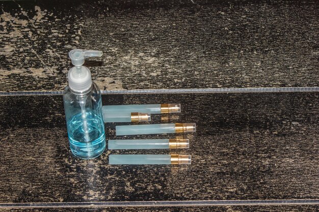 A close-up of perfume bottles neatly arranged inside a dark, temperature-controlled closet with a hygrometer showing optimal humidity levels.