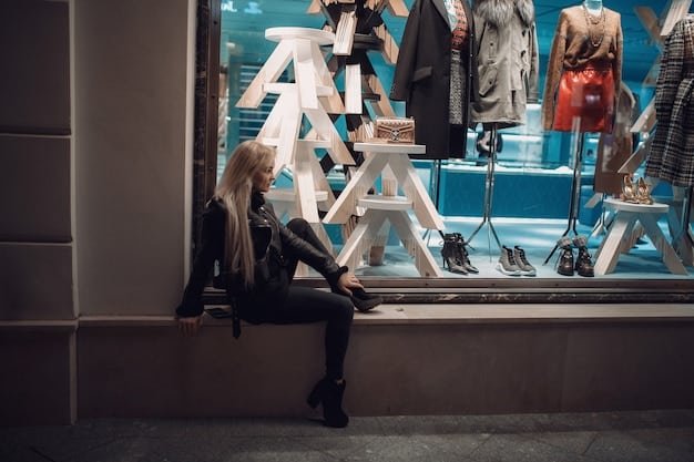 A view inside a busy outlet store, showing racks of clothing, shoes, and accessories, with signs indicating discounted prices, and shoppers browsing the merchandise.