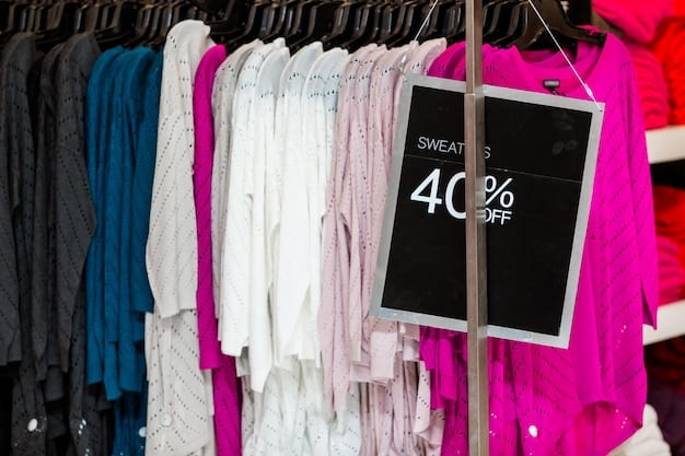 A rack of designer dresses inside an outlet store, with clear signage indicating the discount percentages. Focus on the variety of styles available and the signs showcasing prices significantly reduced from retail.