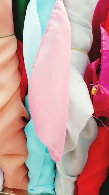 A collage showcasing different affordable dress fabrics, such as chiffon, jersey knit, and polyester blends, alongside examples of simple yet elegant dress styles like A-line and wrap dresses. The collage emphasizes the visual appeal and versatility of these options for wedding guest attire.