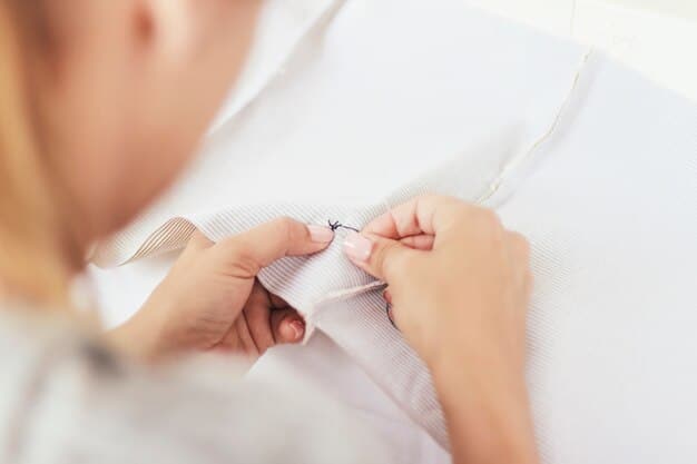A close-up shot of a woman's hands carefully examining the stitching and fabric quality of a garment in a store. The background is slightly blurred, emphasizing the act of assessing quality over the surrounding shopping environment. This highlights the importance of close inspection when buying clothes.