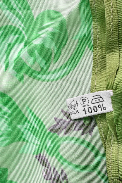 A close-up shot of a garment label showing the GOTS (Global Organic Textile Standard) certification logo, highlighting the details of what this certification means for organic and ethical textile production.
