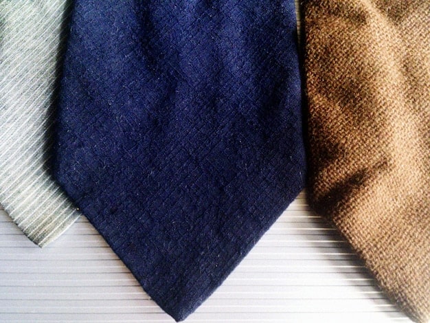 A close-up shot of different fabrics and textures used in clothing items from various budget fashion subscription boxes, potentially including denim, cotton, and knit fabrics.