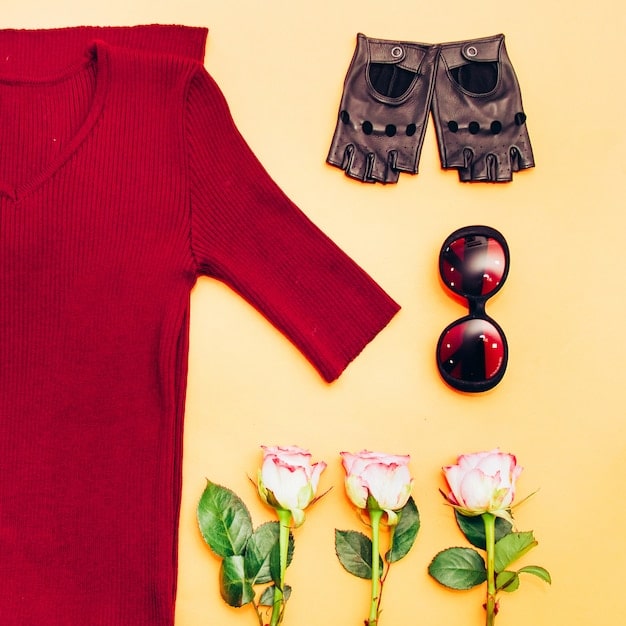 A close-up shot of several pieces of clothing from Shein's new arrivals, including a floral print blouse, a denim skirt, and a pair of stylish sunglasses, arranged on a white surface with soft, natural lighting.