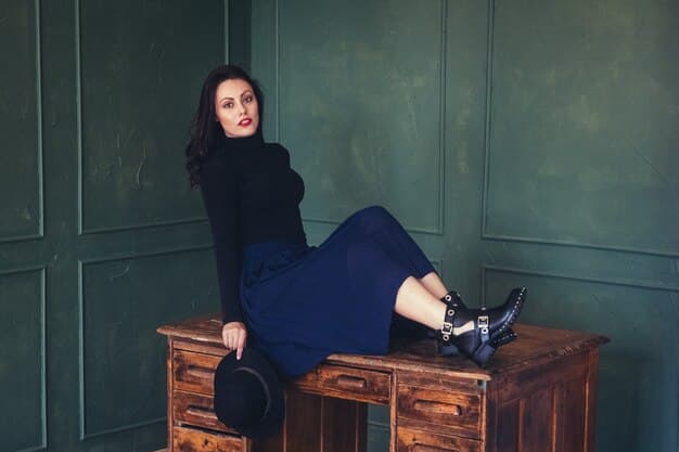 A woman styled in a fashionable navy blue monochrome ensemble sourced from Shein, featuring a turtleneck sweater, wide-leg trousers, and pointed-toe boots.