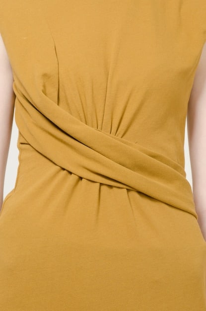 A close-up shot of a Shein wrap dress, showing the adjustable tie at the waist and the flowing A-line skirt, with details of the fabric and pattern.