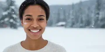 Woman with glowing, hydrated skin in winter landscape, embodying confidence.